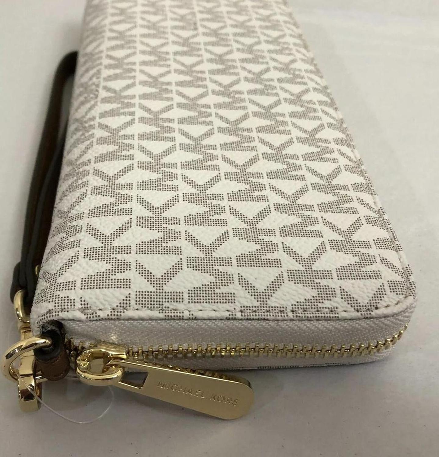 Michael Kors Jet Set Travel ivory Signature PVC Continental Wallet Wristlet