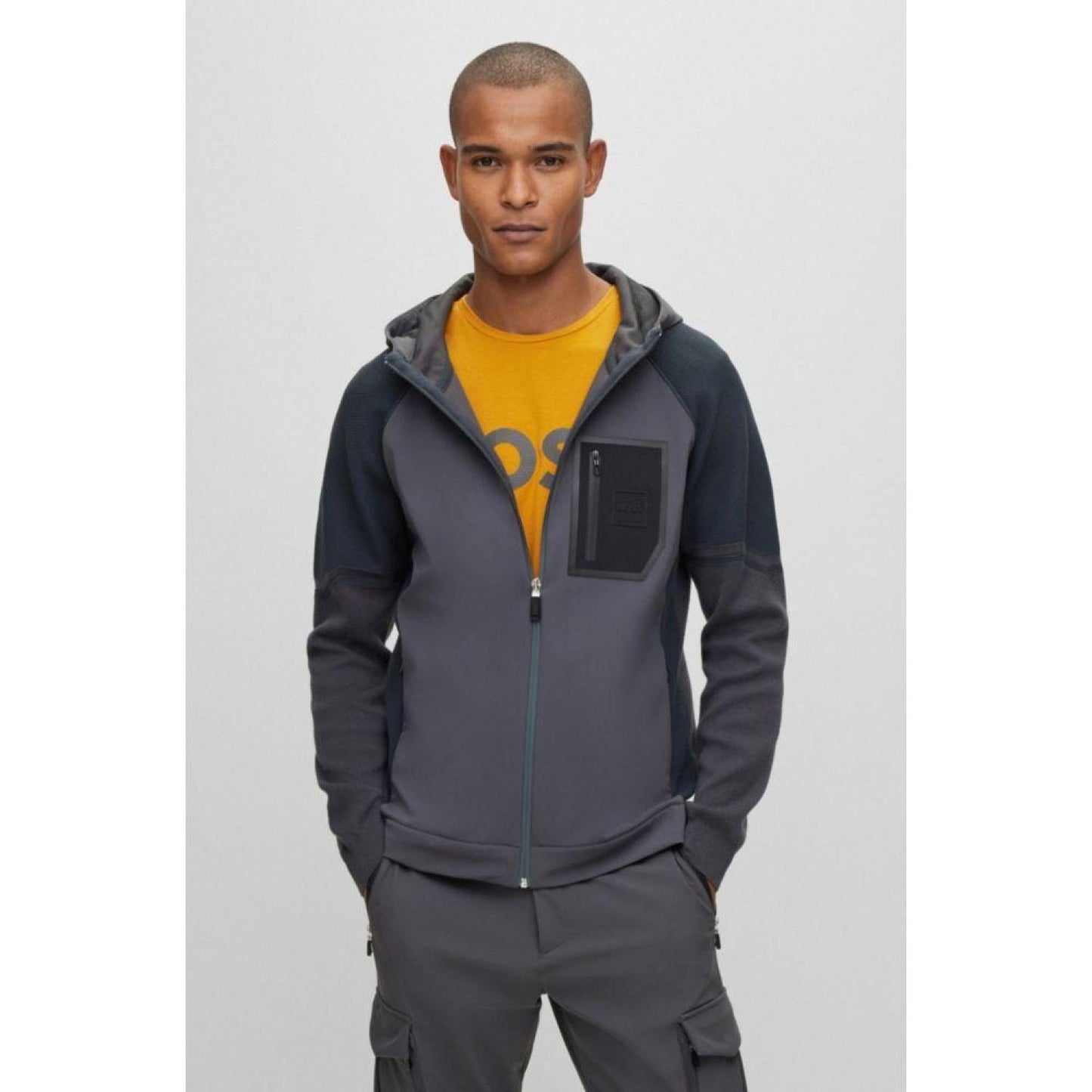 Mixed-material hooded jacket with signature pocket